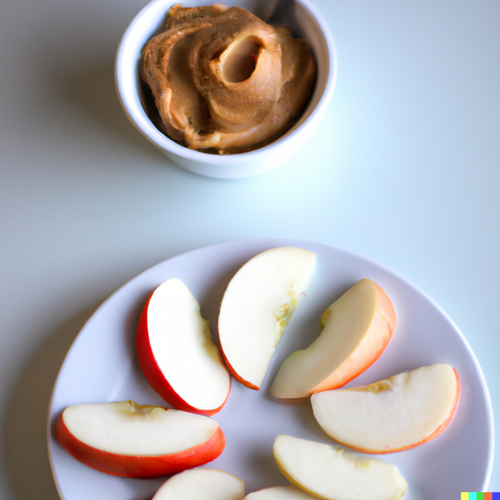 An image of apples slices with a side of peanut butter
